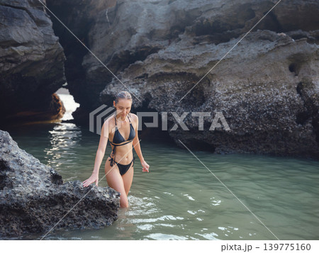 Young woman enjoying serene evening at sea in Krabi, Thailand Young woman enjoying serene evening at sea in Krabi, Thailand 139775160
