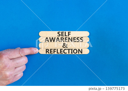 Self awareness and reflection symbol. Concept words Self awareness and reflection on beautiful wooden sticks. Beautiful blue background. Psychological self awareness reflection concept. Copy space. 139775173