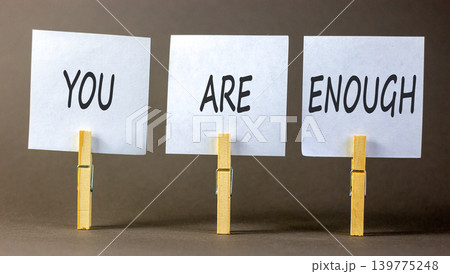 You are enough words symbol. Concept words You are enough on beautiful white papers on wooden clothespin. Beautiful grey background. Business motivational and you are enough concept. Copy space. You are enough words symbol. Concept words You are enough on beautiful white papers on wooden clothespin. Beautiful grey background. Business motivational and you are enough concept. Copy space. 139775248
