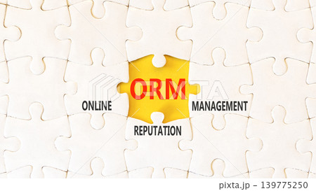 ORM online reputation management symbol. Concept words ORM online reputation management on beautiful white puzzles. Beautiful yellow background. Business ORM concept. Copy space. 139775250
