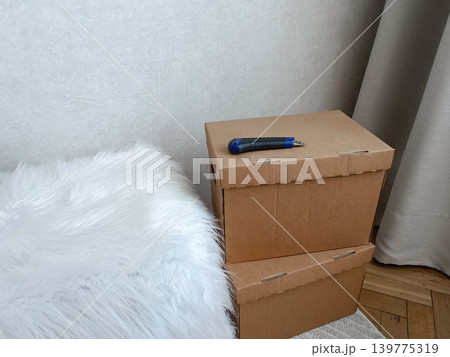 Cardboard Moving Boxes with Box Cutter Cardboard Moving Boxes with Box Cutter 139775319