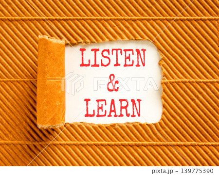 Listen and learn words symbol. Concept words Listen and learn on beautiful white paper. Beautiful brown background. Business listen and learn support concept. Copy space. Listen and learn words symbol. Concept words Listen and learn on beautiful white paper. Beautiful brown background. Business listen and learn support concept. Copy space. 139775390