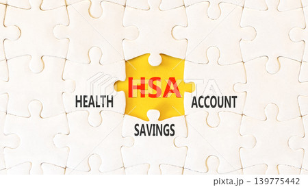 HSA health saving account symbol. Concept words HSA health saving account on beautiful white puzzles. Beautiful yellow background. Medical HSA health saving account concept. Copy space. HSA health saving account symbol. Concept words HSA health saving account on beautiful white puzzles. Beautiful yellow background. Medical HSA health saving account concept. Copy space. 139775442