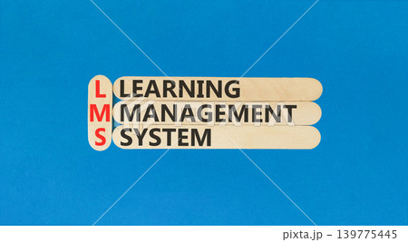 LMS learning management system symbol. Concept words LMS learning management system on beautiful wooden sticks. Beautiful blue background. Business LMS learning management system concept. Copy space 139775445