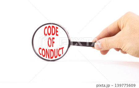 Code of conduct words symbol. Concept words Code of conduct on beautiful magnifying glass. Beautiful white background. Businessman hand. Business Code of conduct concept. Copy space. Code of conduct words symbol. Concept words Code of conduct on beautiful magnifying glass. Beautiful white background. Businessman hand. Business Code of conduct concept. Copy space. 139775609