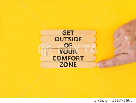 Leave your comfort zone symbol. Concept words Get outside of your comfort zone on beautiful wooden stick. Beautiful yellow background. Business psychological Leave comfort zone concept. Copy space. Leave your comfort zone symbol. Concept words Get outside of your comfort zone on beautiful wooden stick. Beautiful yellow background. Business psychological Leave comfort zone concept. Copy space. 139775669