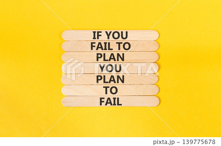 Planning to fail symbol. Concept words If you fail to plan you plan to fail on beautiful wooden sticks. Beautiful yellow paper background. Business planning to fail concept. Copy space. Planning to fail symbol. Concept words If you fail to plan you plan to fail on beautiful wooden sticks. Beautiful yellow paper background. Business planning to fail concept. Copy space. 139775678