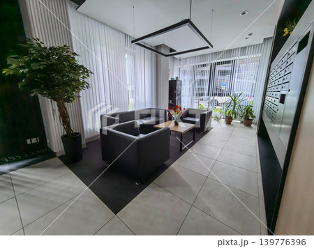 Modern office lobby waiting room with leather furniture and mailboxes 139776396
