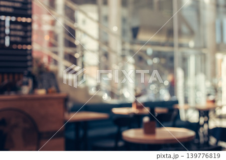 Blurred background of cafe with big windows on a sunny day. Blurred background of cafe with big windows on a sunny day. 139776819
