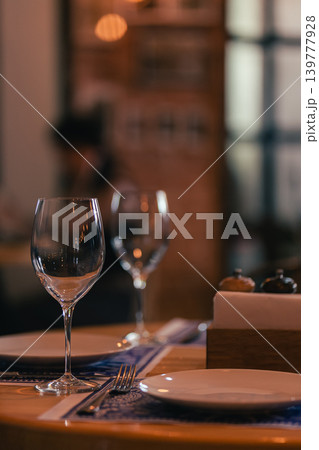 Wine glasses on the banque table in restaurant. Wine glasses on the banque table in restaurant. 139777928