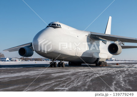 White wide body freight transport airplane at winter airport White wide body freight transport airplane at winter airport 139779249