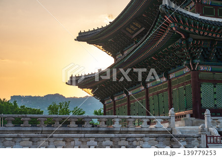 Seoul, South Korea - May. 17, 2026 : Majestic Geunjeongjeon Hall in Gyeongbokgung Palace glowing in intense sunset light, Seoul, South Korea 139779253