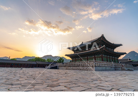 Seoul, South Korea - May. 17, 2026 : Majestic Geunjeongjeon Hall in Gyeongbokgung Palace glowing in intense sunset light, Seoul, South Korea 139779255