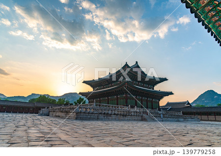 Seoul, South Korea - May. 17, 2026 : Majestic Geunjeongjeon Hall in Gyeongbokgung Palace glowing in intense sunset light, Seoul, South Korea 139779258