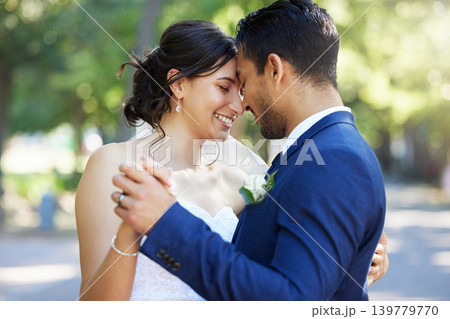 Forehead, dance and couple at wedding outdoor for marriage, love or commitment in nature. Bride, groom and embrace for affection, nuptials and people with partner for support and connection in park 139779770