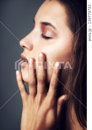 Beauty, skincare and face of woman on gray background for wellness, healthy skin and hair care. Salon, aesthetic and profile of person with hairstyle for cosmetics, luxury and treatment in studio 139779783