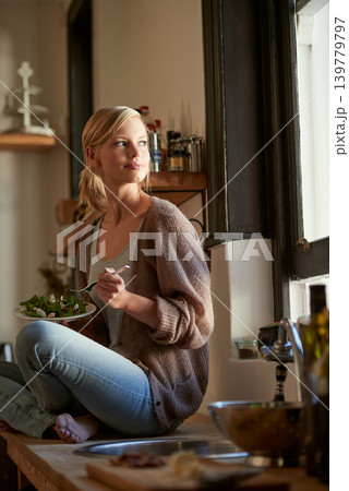 Woman, kitchen and nutrition with smile, lunch and home for salad, vegetables and diet. Designer, house and break for health, wellness and relaxation and break for wellbeing, rest and happiness Woman, kitchen and nutrition with smile, lunch and home for salad, vegetables and diet. Designer, house and break for health, wellness and relaxation and break for wellbeing, rest and happiness 139779797