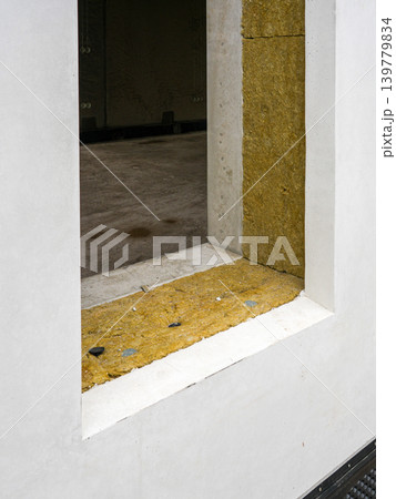 SIP panel modular house window opening with mineral wool insulation layer during prefab construction 139779834