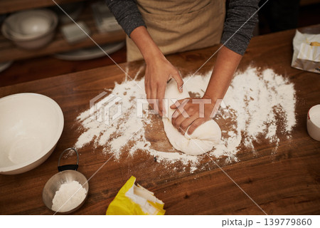 Hands, dough and flour on table in kitchen, bakery for bread or pizza with meal, catering and cooking. Culinary, chef or baker person with pastry preparation, ingredients and food for nutrition 139779860