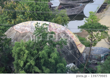 Giant Turtle Statue by River with Boats Giant Turtle Statue by River with Boats 139779985