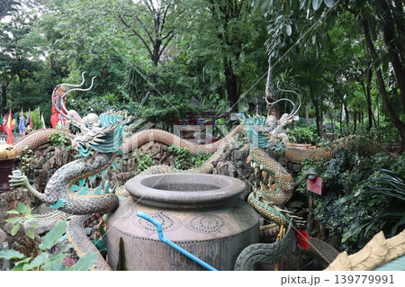 Dragon Sculptures in Lush Garden Setting 139779991