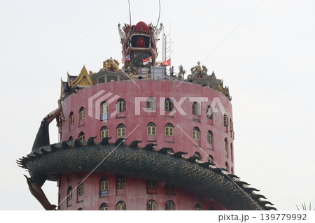 Pink Building with Dragon Sculpture and Traditional Roof Pink Building with Dragon Sculpture and Traditional Roof 139779992
