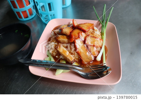 Soy Sauce Glazed Meat Over Rice with Garnish Soy Sauce Glazed Meat Over Rice with Garnish 139780015