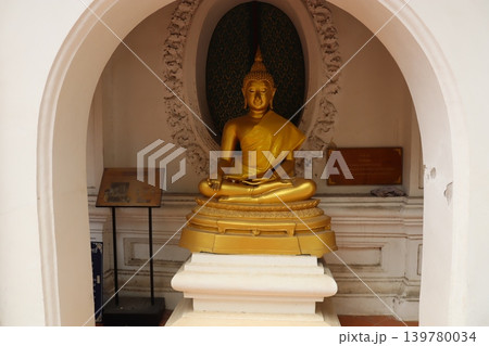 Golden Buddha Statue in Sacred Archway 139780034