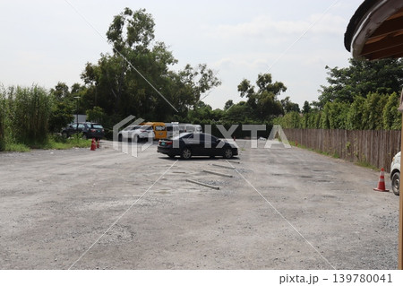 Outdoor Parking Lot with Vehicles and Greenery Outdoor Parking Lot with Vehicles and Greenery 139780041
