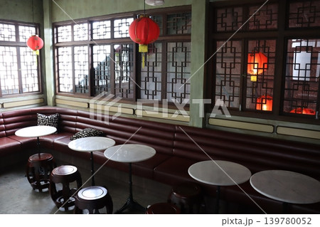 Traditional Chinese Restaurant Interior with Red Lanterns and Booths 139780052