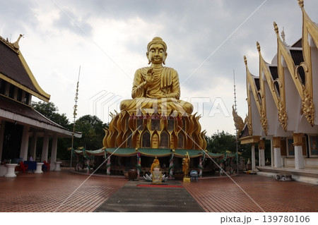 Golden Buddha Statue in Thai Temple Complex Golden Buddha Statue in Thai Temple Complex 139780106