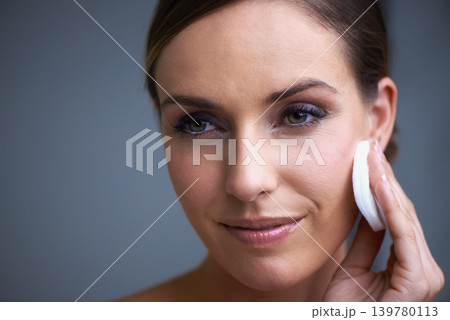 Skincare, smile and woman in studio with natural, beauty and cosmetic facial routine for wellness. Health, happy and female person with face dermatology treatment by gray background with mockup. 139780113