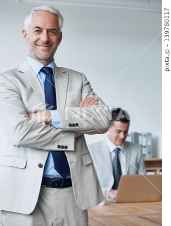 Senior businessman, portrait and confidence in management, agency and pride for mentoring in office. Male person, arms crossed and happy for support in training, advisor and laptop for planning Senior businessman, portrait and confidence in management, agency and pride for mentoring in office. Male person, arms crossed and happy for support in training, advisor and laptop for planning 139780117