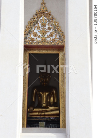 Golden Buddha Statue in Ornate Niche 139780164