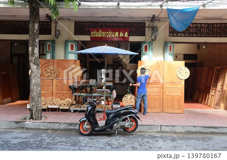 Wooden Craft Shop with Scooter and Vendor Wooden Craft Shop with Scooter and Vendor 139780167