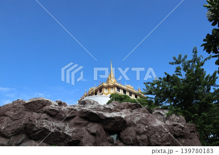 Golden Temple on Rocky Hill Under Clear Blue Sky Golden Temple on Rocky Hill Under Clear Blue Sky 139780183