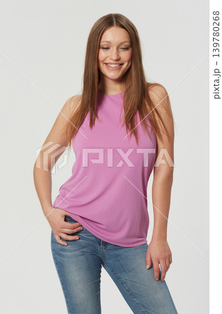 Woman, fashion and style confidence in studio for cool trend with jeans for relax, clothes or white background. Female person, model and smile with mockup space for natural beauty, casual or Canada 139780268