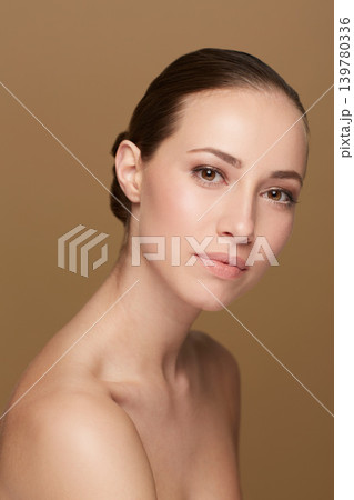 Skincare, beauty or portrait of natural woman in studio isolated on brown background for pride or wellness. Smooth face, body cosmetics or confident model or healthy female person with shine or glow Skincare, beauty or portrait of natural woman in studio isolated on brown background for pride or wellness. Smooth face, body cosmetics or confident model or healthy female person with shine or glow 139780336