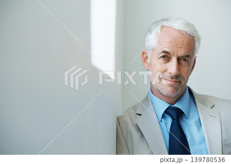 Portrait, mature man and corporate in suit with copy space, confidence and serious look with determination at office. Businessman, executive and professional with experience, wisdom and success. Portrait, mature man and corporate in suit with copy space, confidence and serious look with determination at office. Businessman, executive and professional with experience, wisdom and success. 139780536