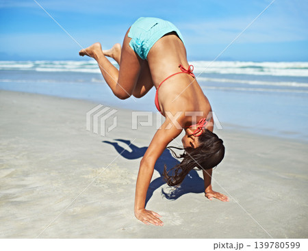 Handstand, beach and woman with vacation, fitness and summer with adventure and movement. Person, seaside and girl with activity or holiday with journey and sunshine with workout or excited with trip Handstand, beach and woman with vacation, fitness and summer with adventure and movement. Person, seaside and girl with activity or holiday with journey and sunshine with workout or excited with trip 139780599