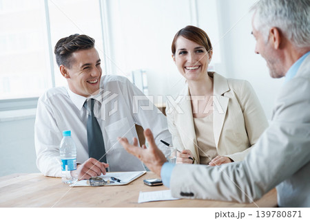 Laughing,, smile or business people in meeting for teamwork or planning growth strategy ideas. Happy, humor and CEO speaking of funny joke with group of employees, colleagues or workers in boardroom 139780871