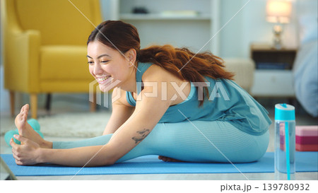 Woman, yoga and stretching for fitness, wellness in healthy spiritual zen exercise for mental wellbeing at home. Female in calm, relax and peaceful exercising workout for mind, body and spirit on mat Woman, yoga and stretching for fitness, wellness in healthy spiritual zen exercise for mental wellbeing at home. Female in calm, relax and peaceful exercising workout for mind, body and spirit on mat 139780932