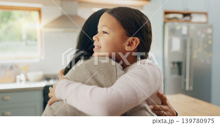 Love, mom and girl in a hug in family home with support, trust and bonding in kitchen or happy childhood memory of daughter. Smile, face and kid in embrace with mother, woman or together with mommy Love, mom and girl in a hug in family home with support, trust and bonding in kitchen or happy childhood memory of daughter. Smile, face and kid in embrace with mother, woman or together with mommy 139780975