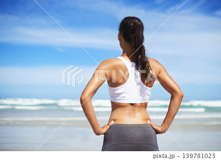 Back, beach and woman with fitness, vacation and training with summer break or sunshine with water. Person, seaside or runner with workout or practice with fresh air or athlete with wellness or waves 139781023