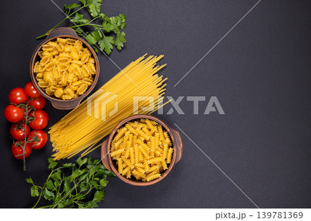 Italian pasta ingredients with fresh tomatoes and parsley Italian pasta ingredients with fresh tomatoes and parsley 139781369