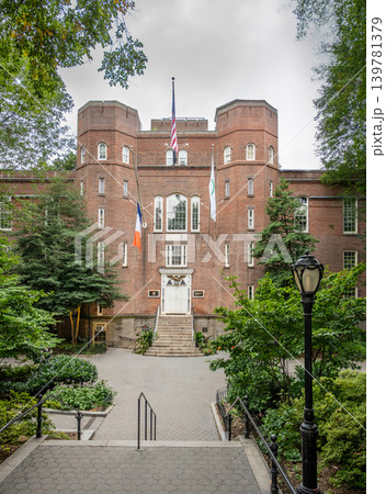 New york, usa august 18,2024. Arsenal building, a historic landmark and headquarters for nyc parks, featuring brick architecture and flags, surrounded by green trees New york, usa august 18,2024. Arsenal building, a historic landmark and headquarters for nyc parks, featuring brick architecture and flags, surrounded by green trees 139781379