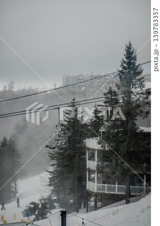 Snowshoe West Virginia Ski Resort in Fog with Chairlift Snow Covered Trees Snowshoe West Virginia Ski Resort in Fog with Chairlift Snow Covered Trees 139783357