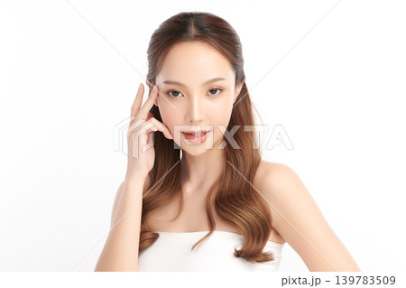 A beautiful young Asian woman with clean, fresh skin against a white background. Skincare, facial treatment, cosmetology, beauty, and spa. An elegant portrait of an Asian woman. A beautiful young Asian woman with clean, fresh skin against a white background. Skincare, facial treatment, cosmetology, beauty, and spa. An elegant portrait of an Asian woman. 139783509