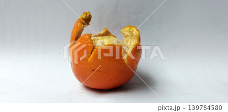 Fresh peeled orange fruit over white background. Fresh peeled orange fruit over white background. 139784580