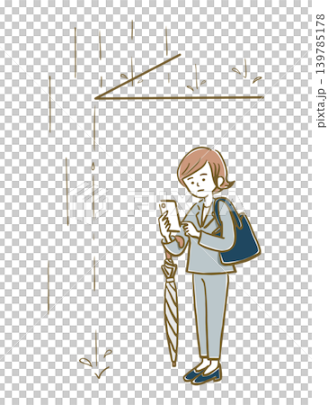 雨宿り中にスマホで連絡をするスーツ姿の女性 雨宿り中にスマホで連絡をするスーツ姿の女性 139785178